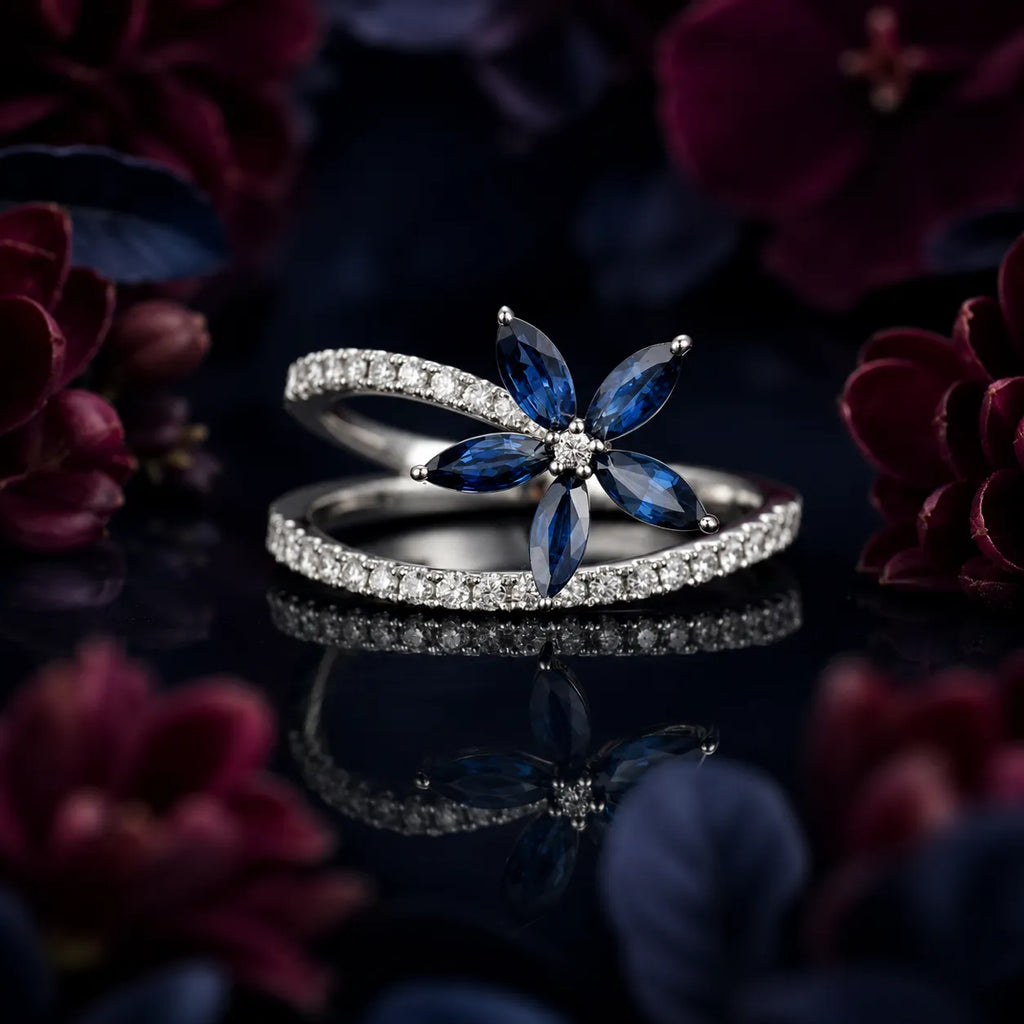 MUHUANG sapphire and diamond flower ring with white gold band on dark floral background