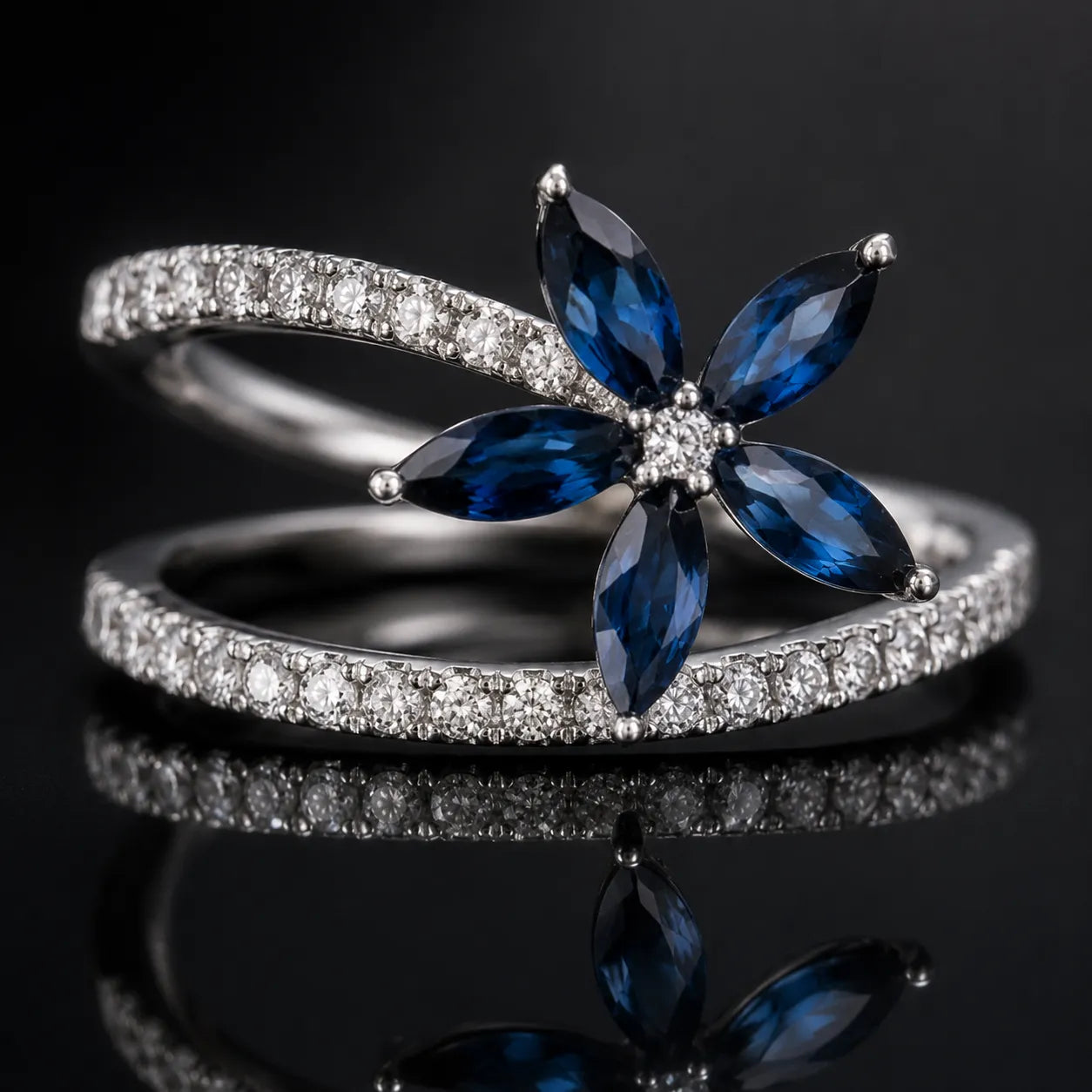 MUHUANG white gold sapphire flower ring with diamond band on black reflective surface