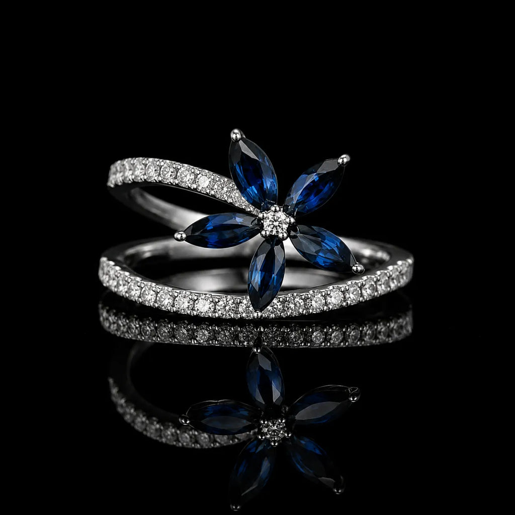 MUHUANG white gold blue sapphire and diamond flower ring on black background