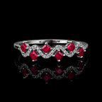 MUHUANG ruby and diamond wave ring in white gold on black background