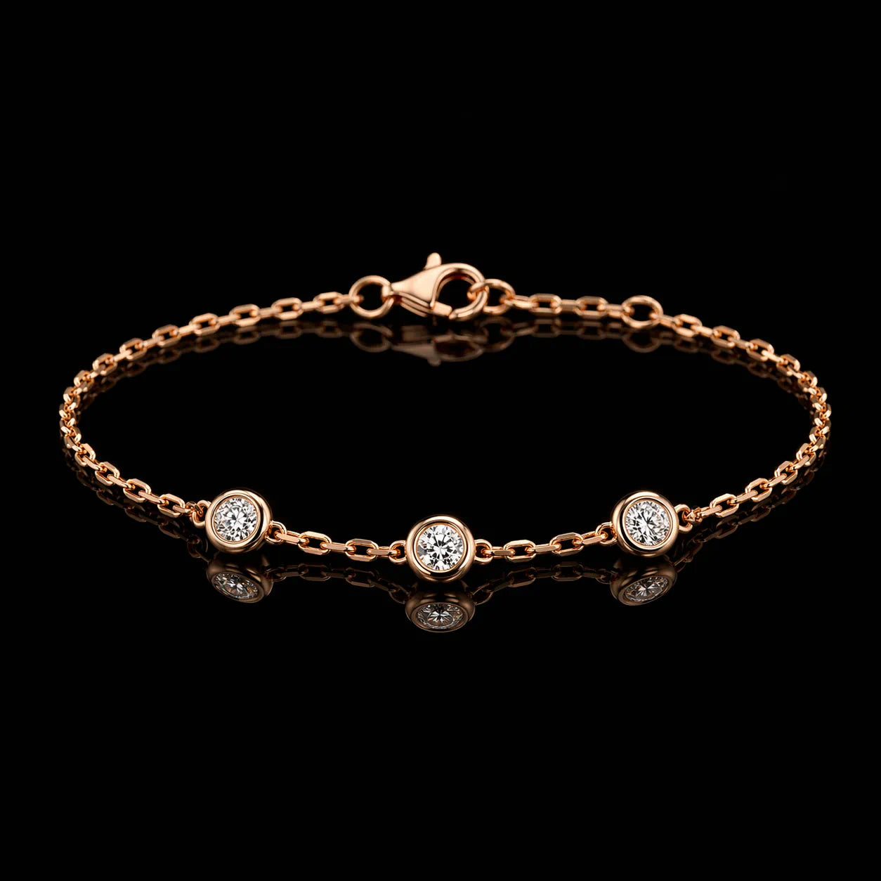 MUHUANG delicate rose-gold bracelet with three bezel-set diamonds on black reflective surface, showcasing minimalist luxury.