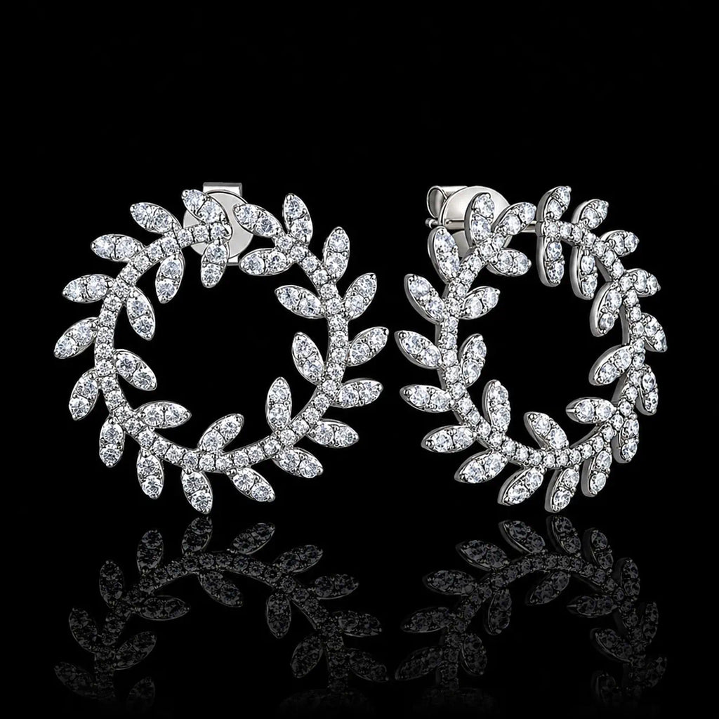 MUHUANG white gold diamond laurel leaf hoop earrings on black background