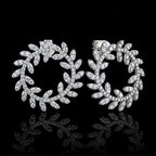 MUHUANG white gold diamond laurel leaf hoop earrings on black background