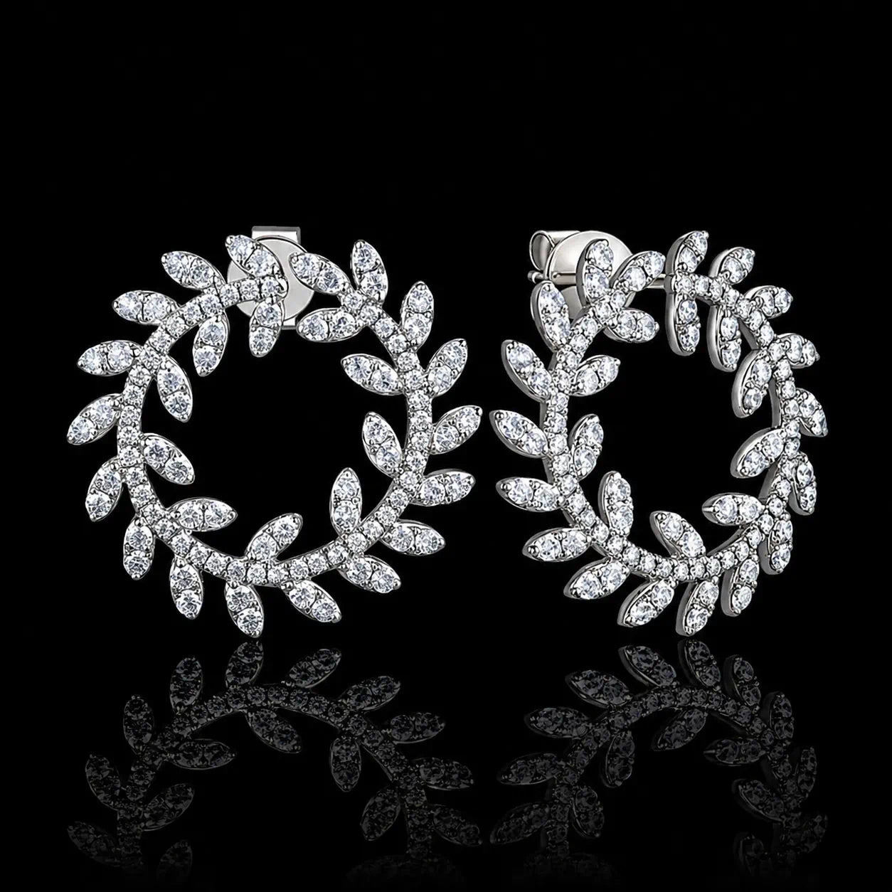 MUHUANG white gold diamond laurel leaf hoop earrings on black background