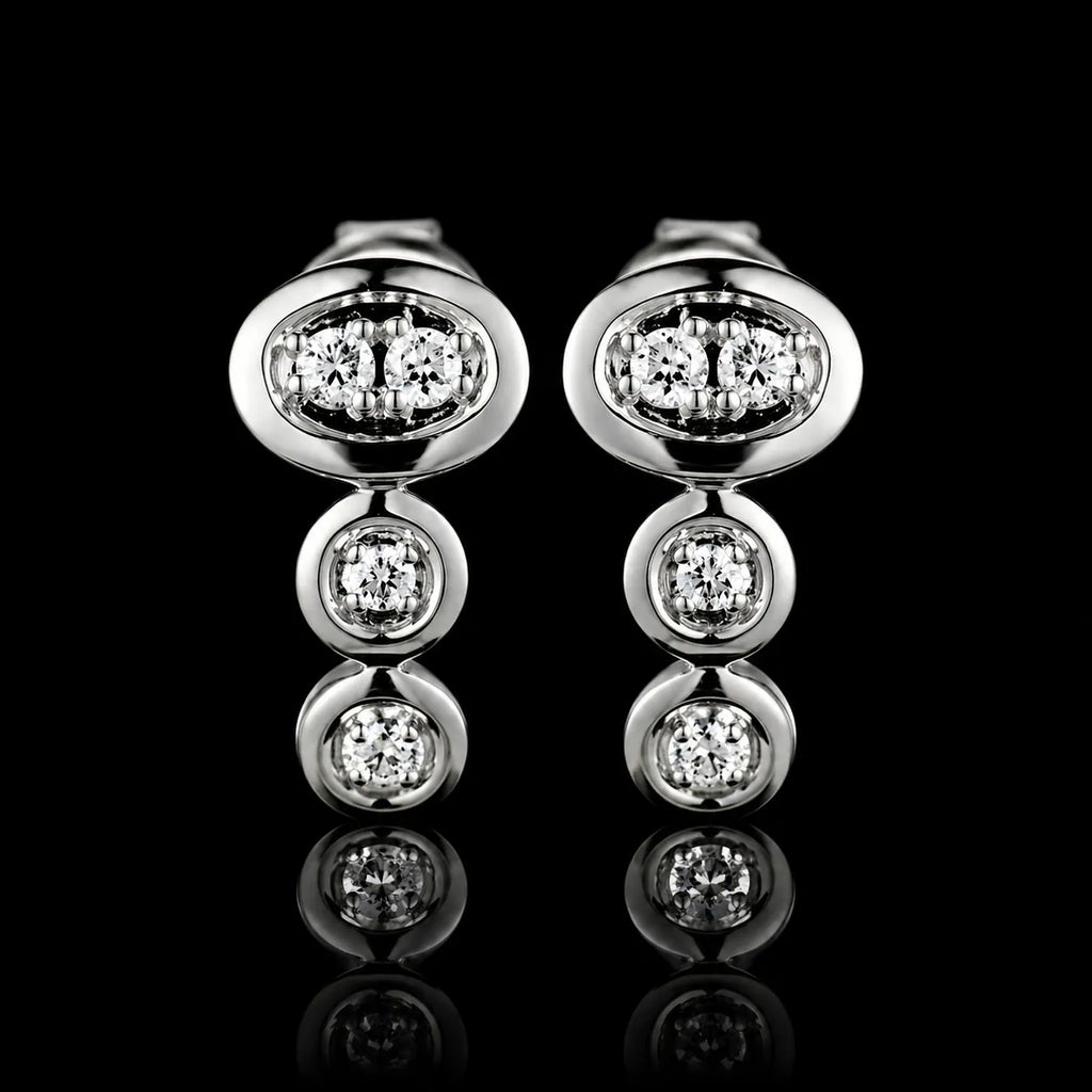 MUHUANG white gold diamond drop earrings on black background