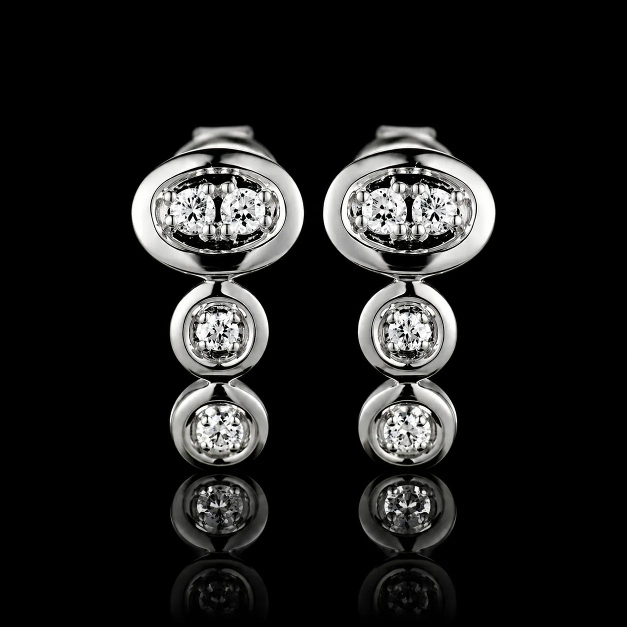 MUHUANG white gold diamond drop earrings on black background