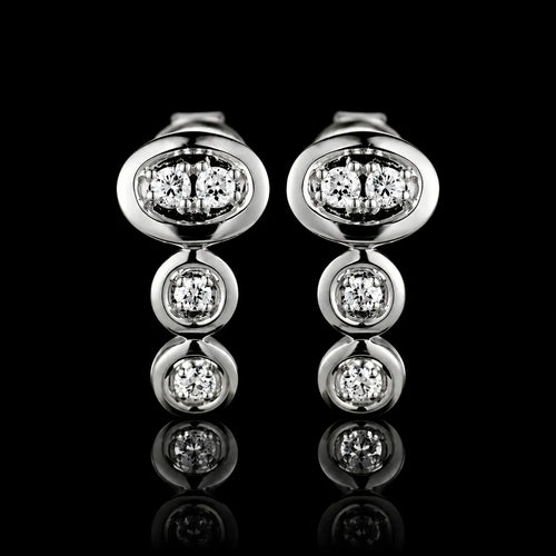 MUHUANG white gold diamond drop earrings on black background