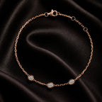 MUHUANG rose-gold bracelet with three bezel diamonds, photographed on dark background to highlight shimmer and luxury.