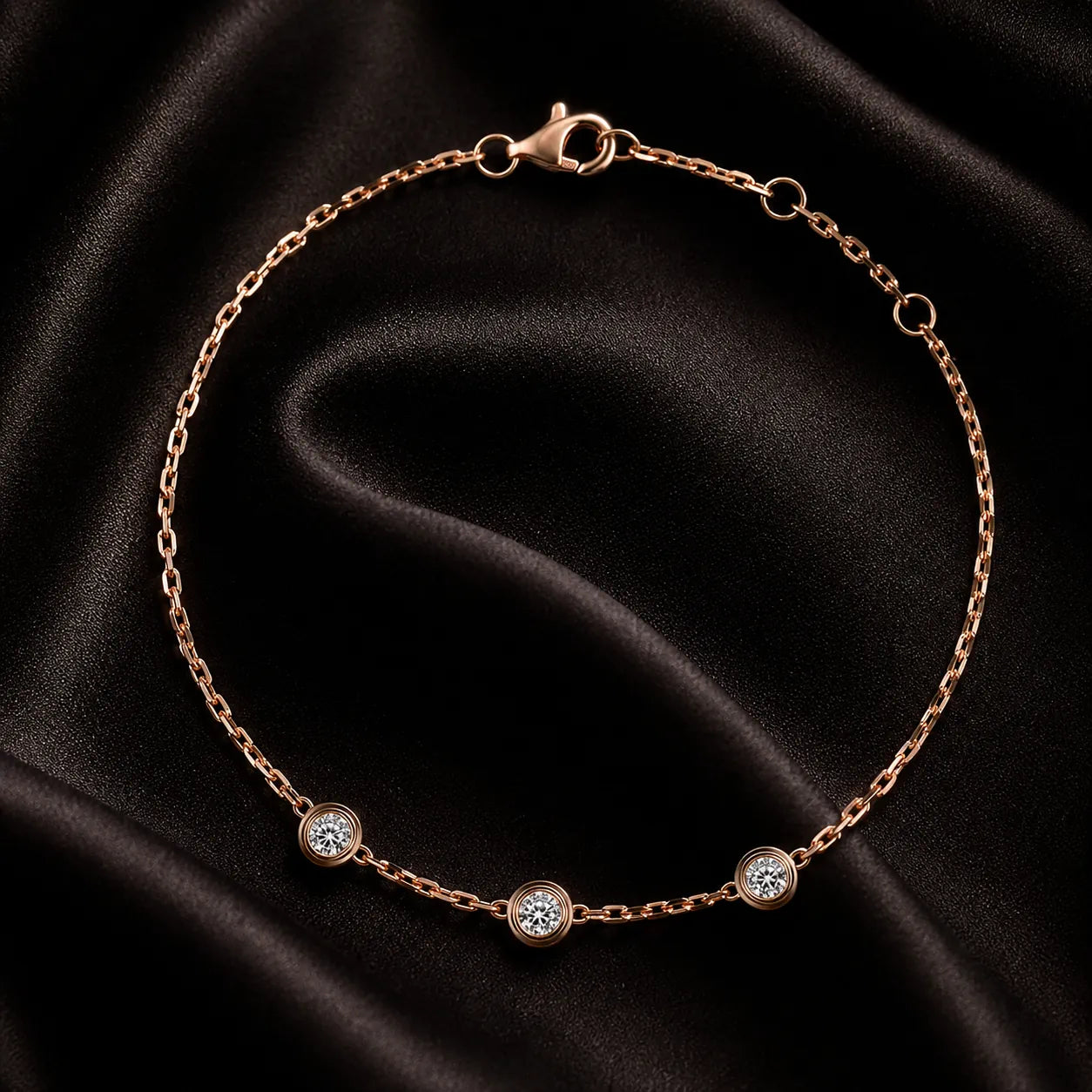 MUHUANG rose-gold bracelet with three bezel diamonds, photographed on dark background to highlight shimmer and luxury.