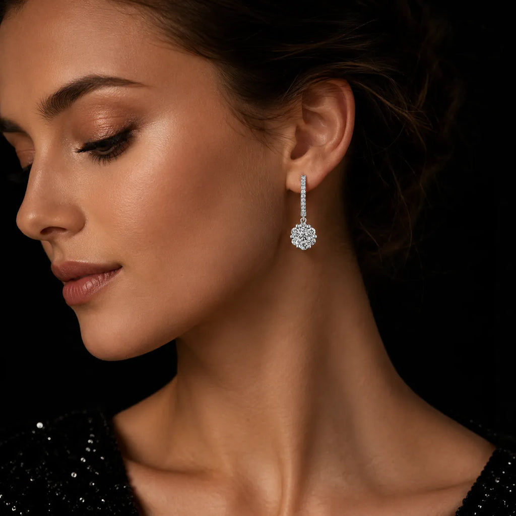 MUHUANG white gold diamond drop earrings worn by model