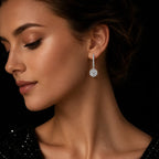 MUHUANG white gold diamond drop earrings worn by model