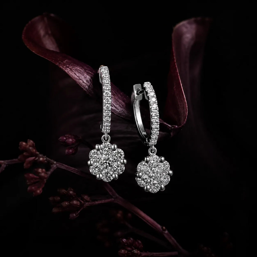 MUHUANG white gold diamond drop hoop earrings with dark floral background