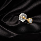 MUHUANG yellow gold diamond stud earring on black satin fabric