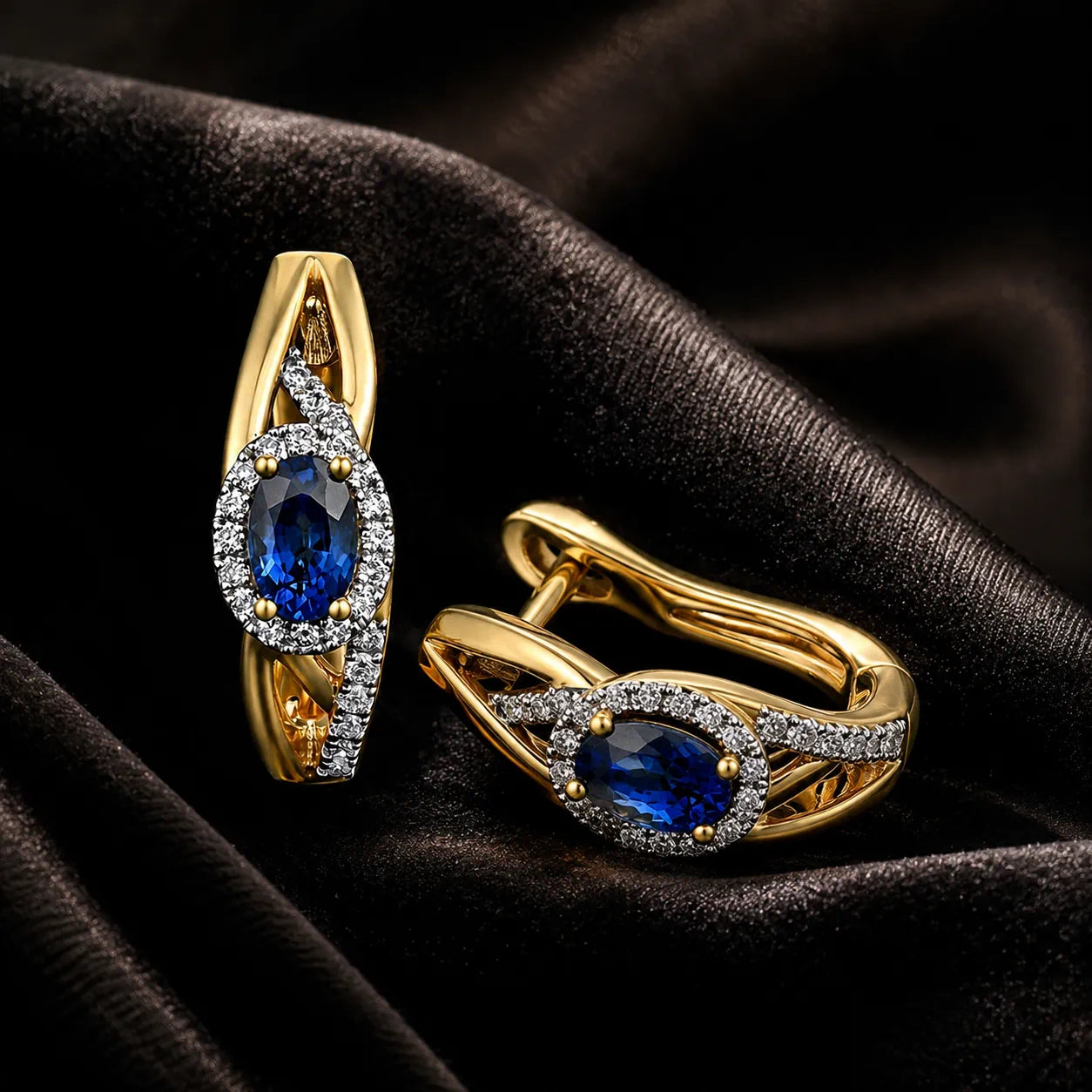 MUHUANG yellow gold sapphire hoop earrings on black satin fabric