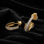 MUHUANG yellow gold diamond hoop earrings on black velvet
