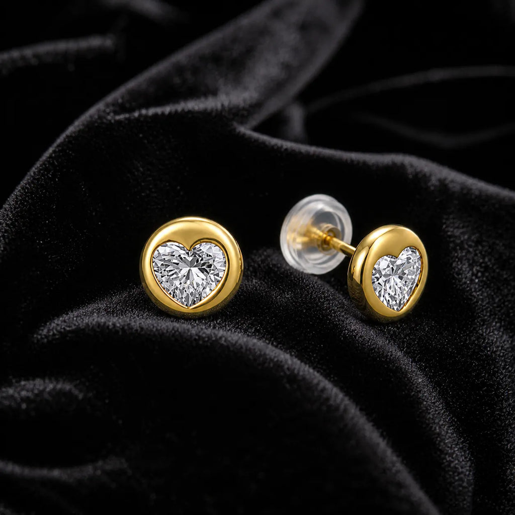 MUHUANG yellow gold heart diamond stud earrings on black velvet