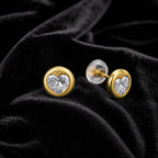 MUHUANG yellow gold heart diamond stud earrings on black velvet
