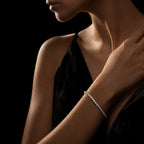 MUHUANG diamond tennis bracelet on wrist with black dress