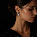 MUHUANG white gold diamond drop earrings worn by model