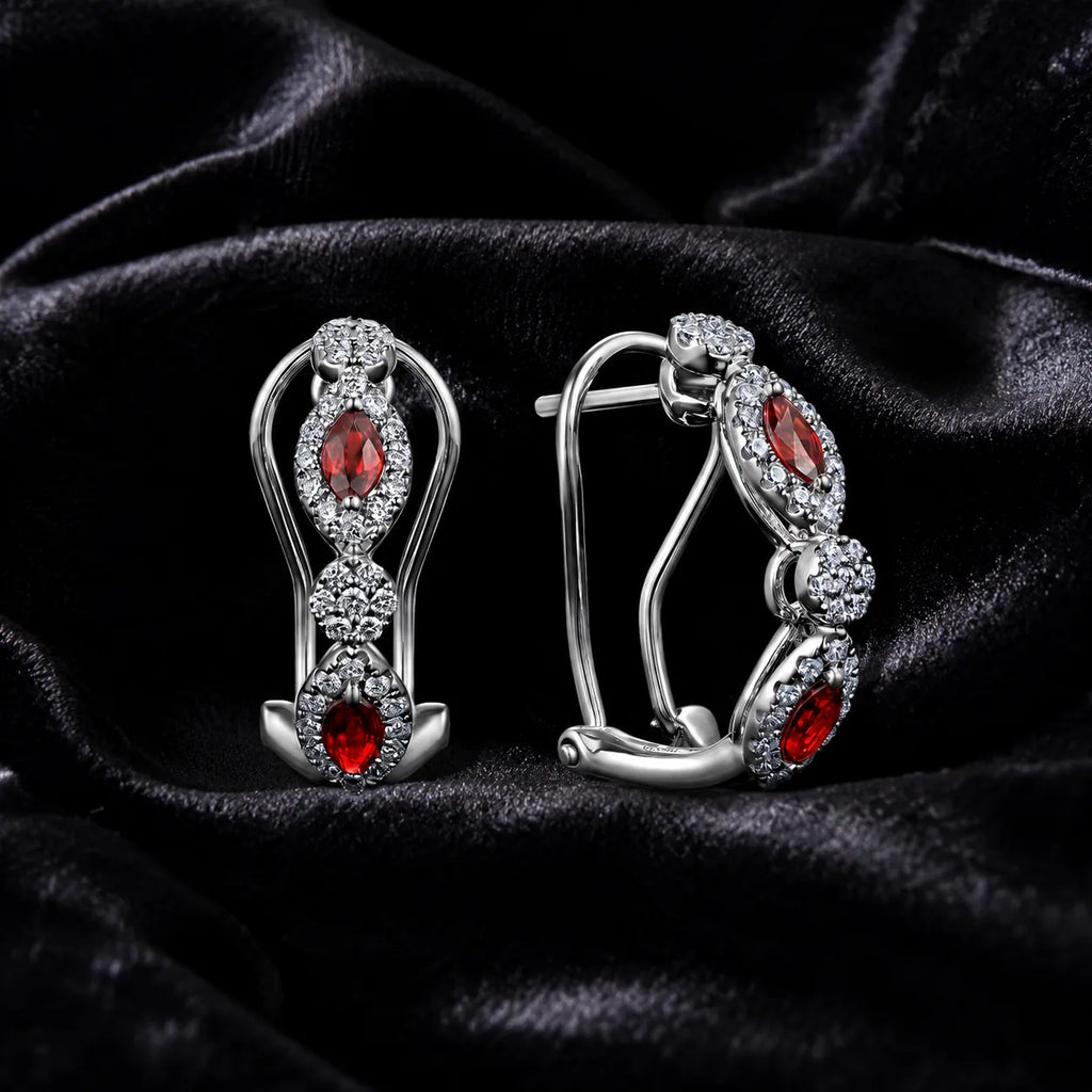 MUHUANG white gold ruby and diamond drop earrings on black satin
