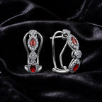 MUHUANG white gold ruby and diamond drop earrings on black satin
