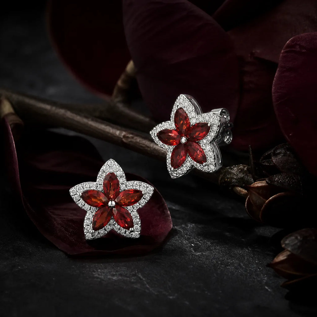 MUHUANG red gemstone flower earrings with diamond halo on dark floral background