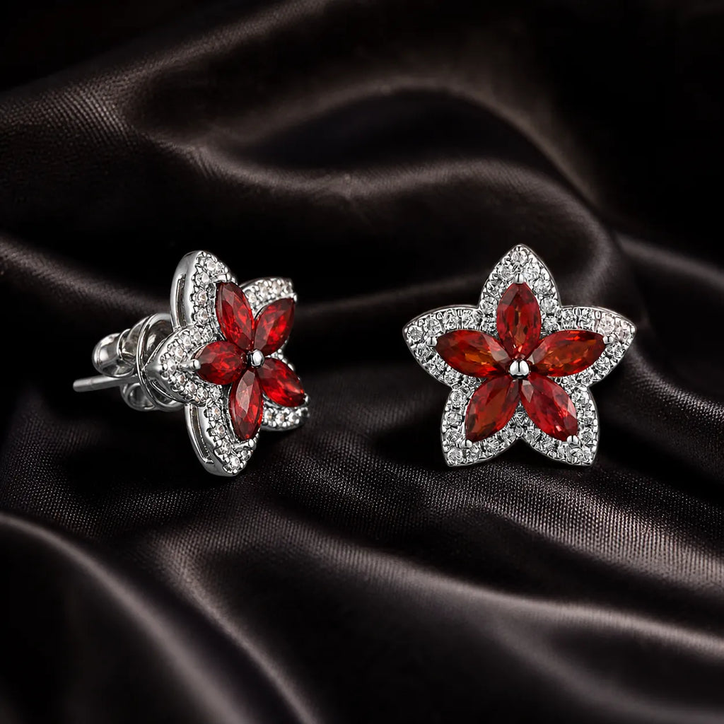 MUHUANG red gemstone flower stud earrings on black satin fabric