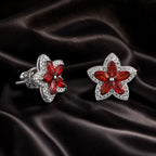 MUHUANG red gemstone flower stud earrings on black satin fabric
