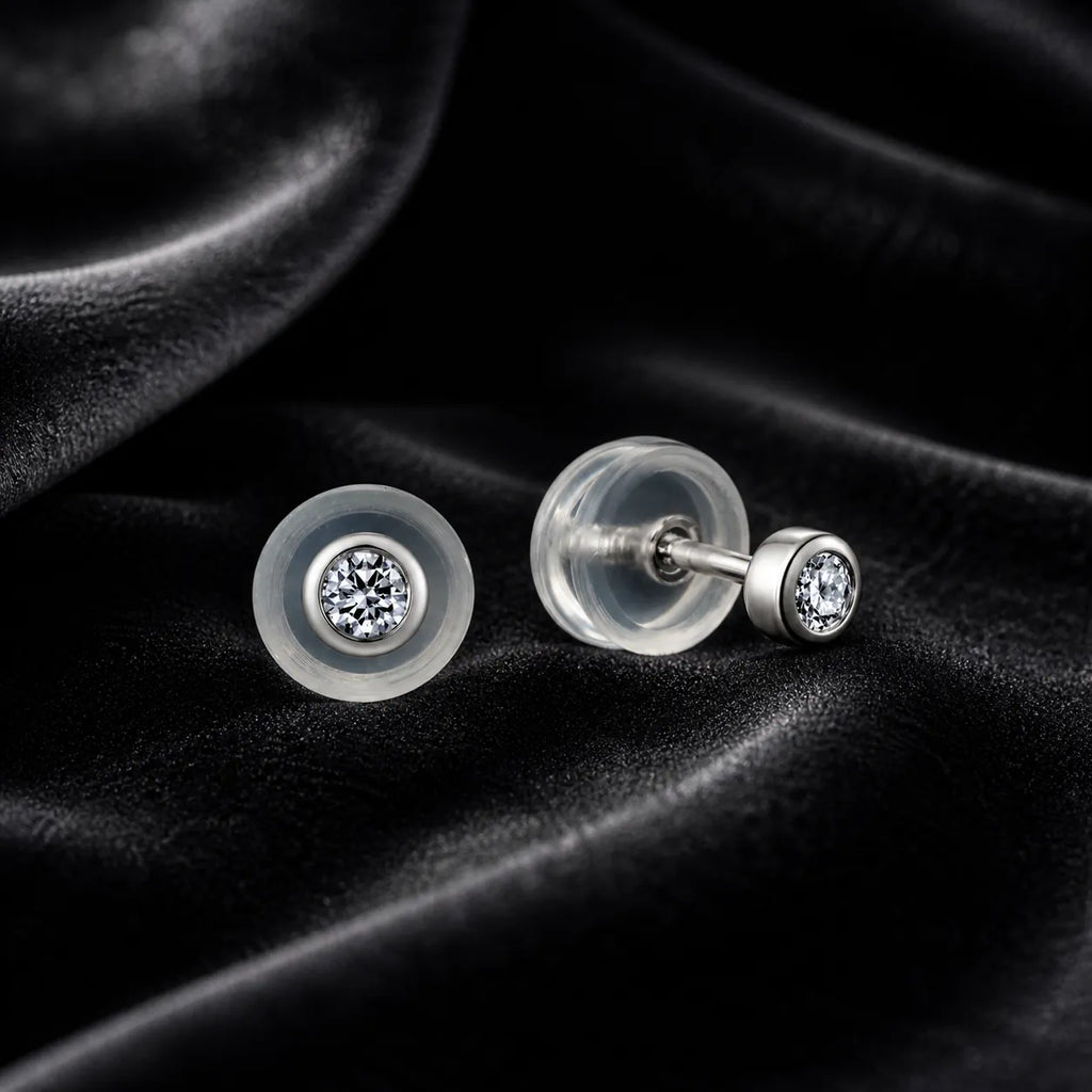 MUHUANG diamond stud earrings on black velvet background
