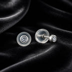 MUHUANG diamond stud earrings on black velvet background