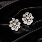 MUHUANG white gold flower diamond stud earrings on black velvet