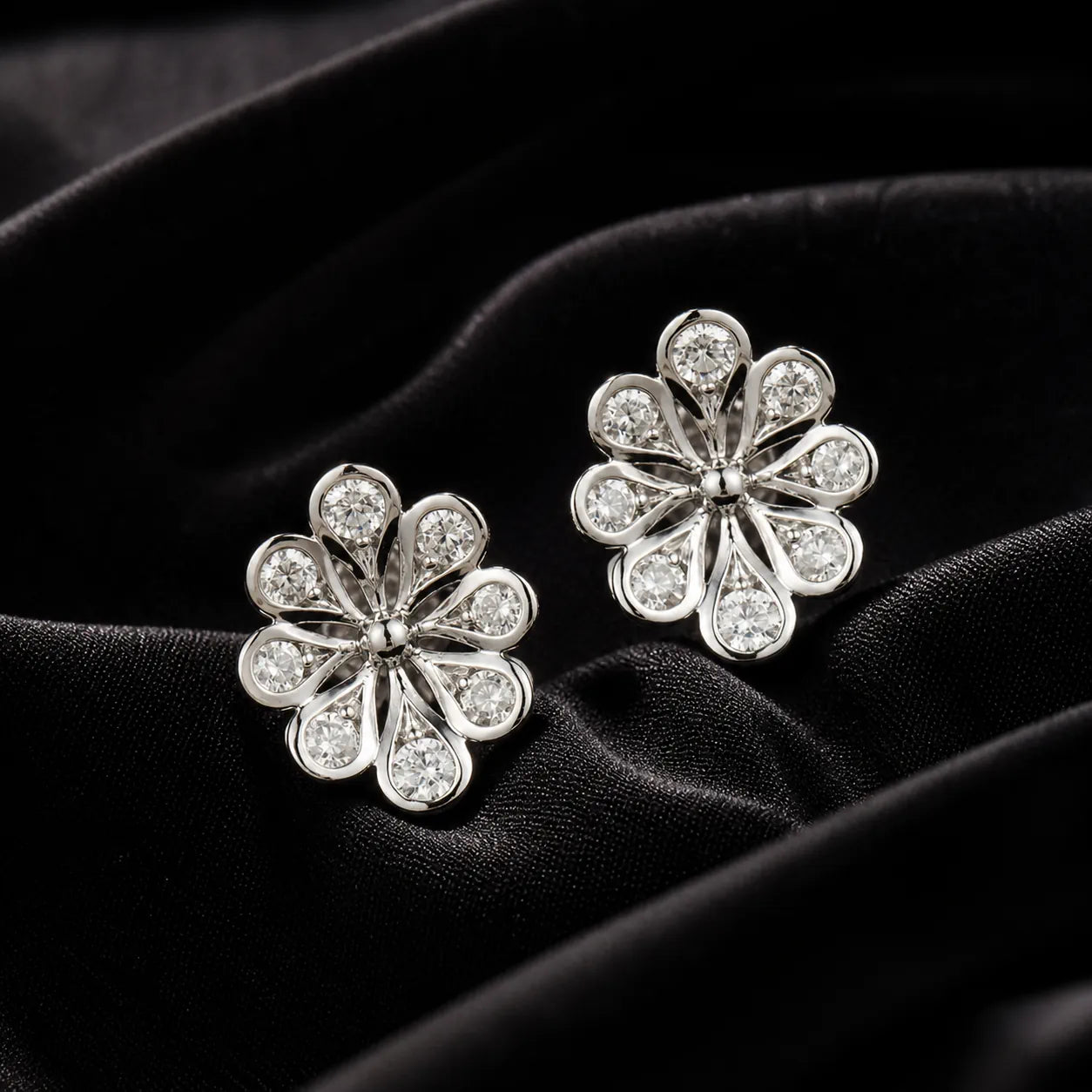 MUHUANG white gold flower diamond stud earrings on black velvet