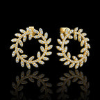 MUHUANG yellow gold diamond laurel hoop earrings on black background