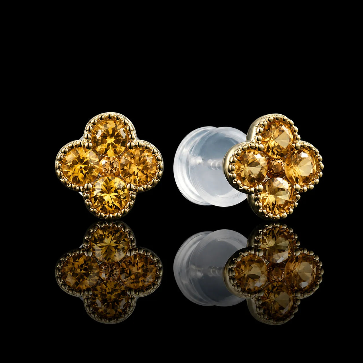 MUHUANG yellow gold four leaf clover citrine stud earrings on black reflective background