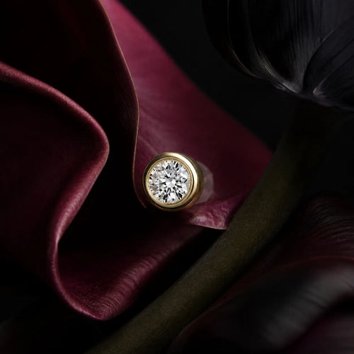 MUHUANG yellow gold diamond stud earring on dark burgundy petals