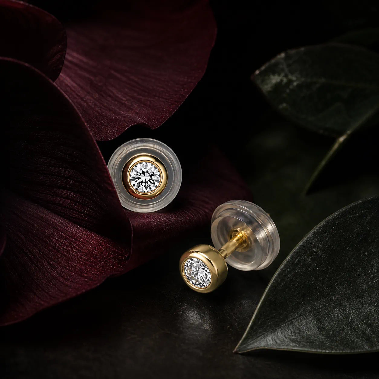 MUHUANG yellow gold diamond stud earrings on burgundy petals