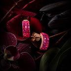 MUHUANG rose gold pink sapphire hoop earrings on dark floral backdrop