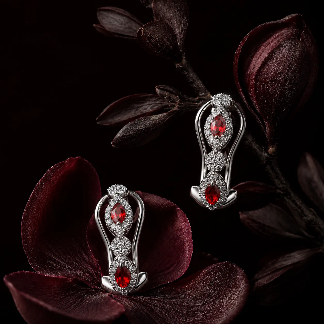 MUHUANG white gold ruby drop earrings with dark floral background