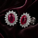 MUHUANG oval ruby and diamond stud earrings on burgundy satin
