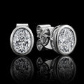 MUHUANG white gold oval diamond stud earrings on black background