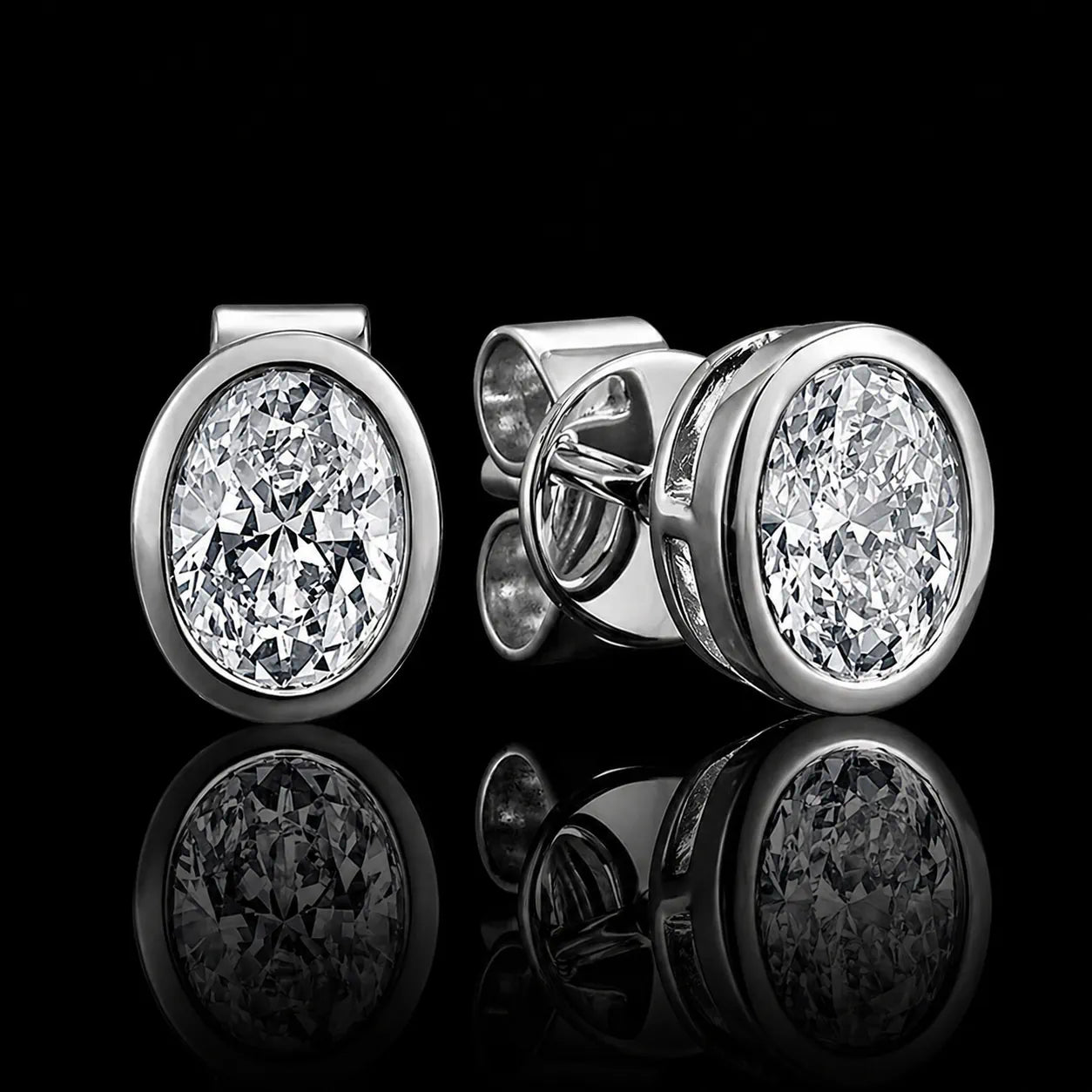 MUHUANG white gold oval diamond stud earrings on black background