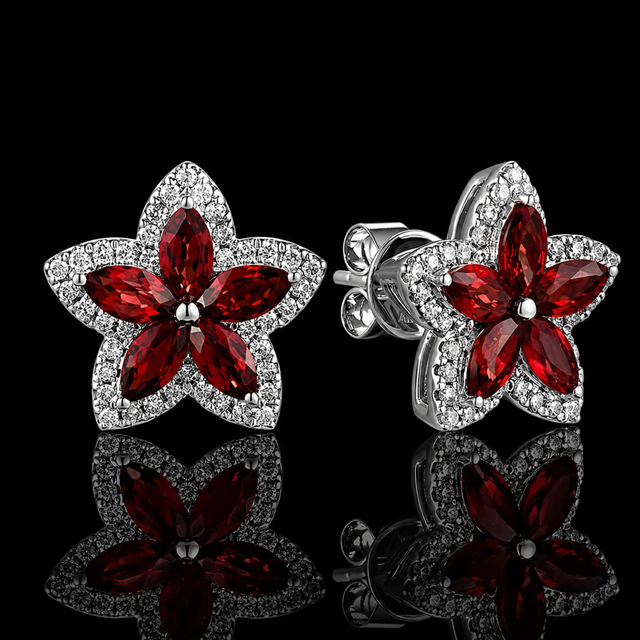 MUHUANG ruby flower stud earrings with diamond accents on black background