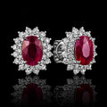 MUHUANG ruby and diamond halo stud earrings on black background