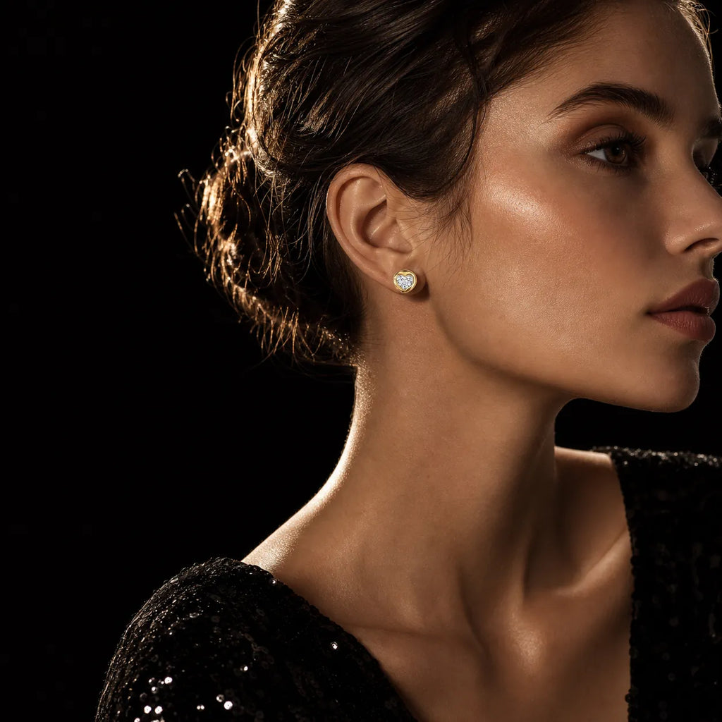 MUHUANG yellow gold heart diamond stud earrings worn by model
