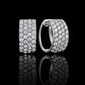 MUHUANG white gold pavé diamond hoop earrings on black reflective background