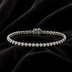 MUHUANG diamond tennis bracelet displayed on black velvet