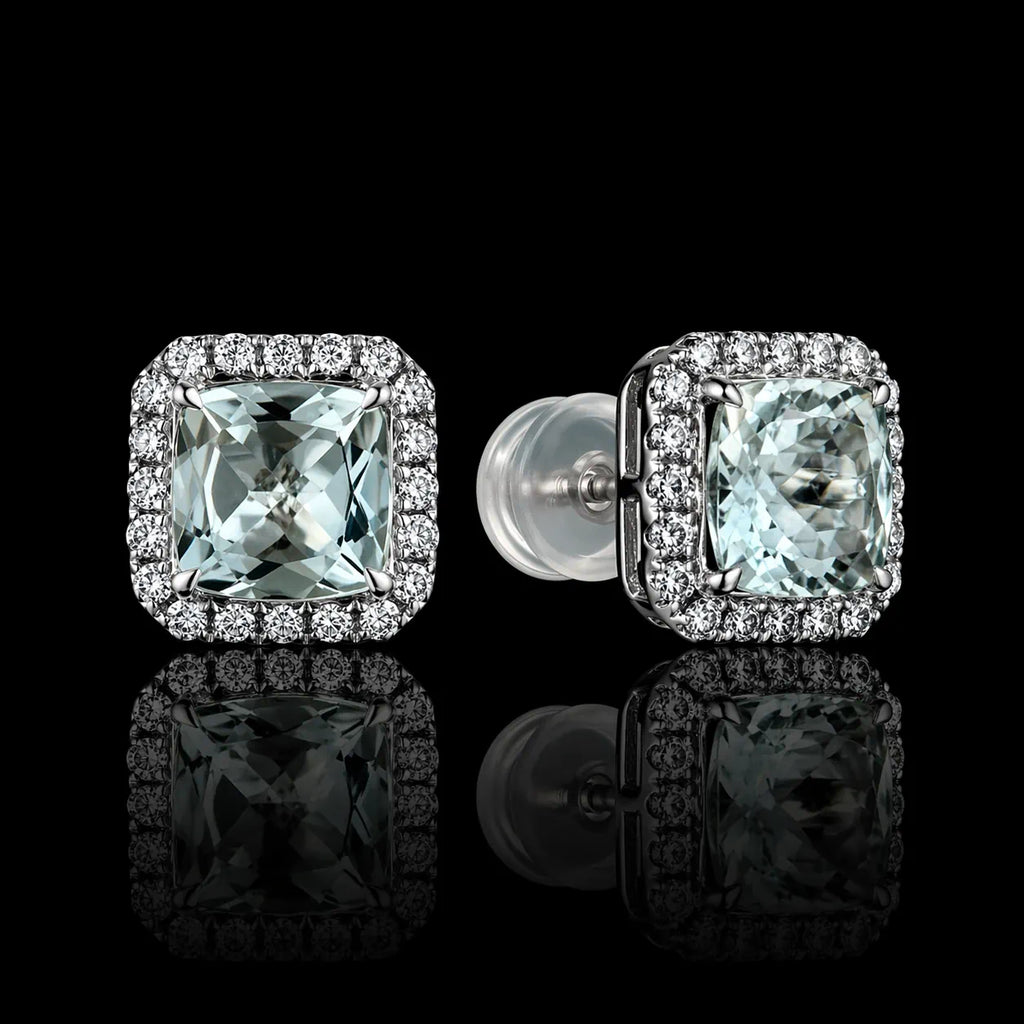 MUHUANG square-cut light blue gemstone stud earrings with diamond halo on reflective black surface, highlighting elegance and brilliance.