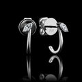 MUHUANG 18K white gold marquise diamond hoop earrings on black reflective background