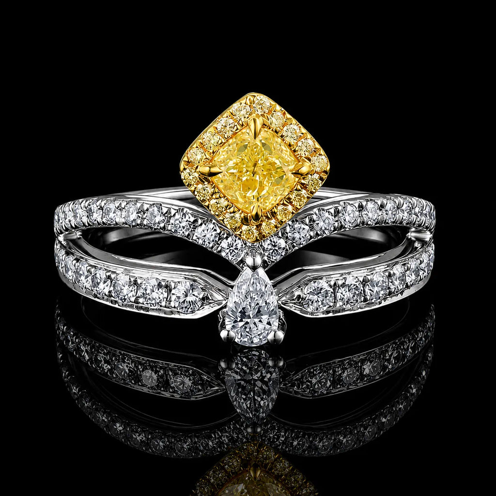 18K yellow and white gold yellow diamond ring, cushion-cut yellow center diamond with halo of white diamonds, on black reflective background